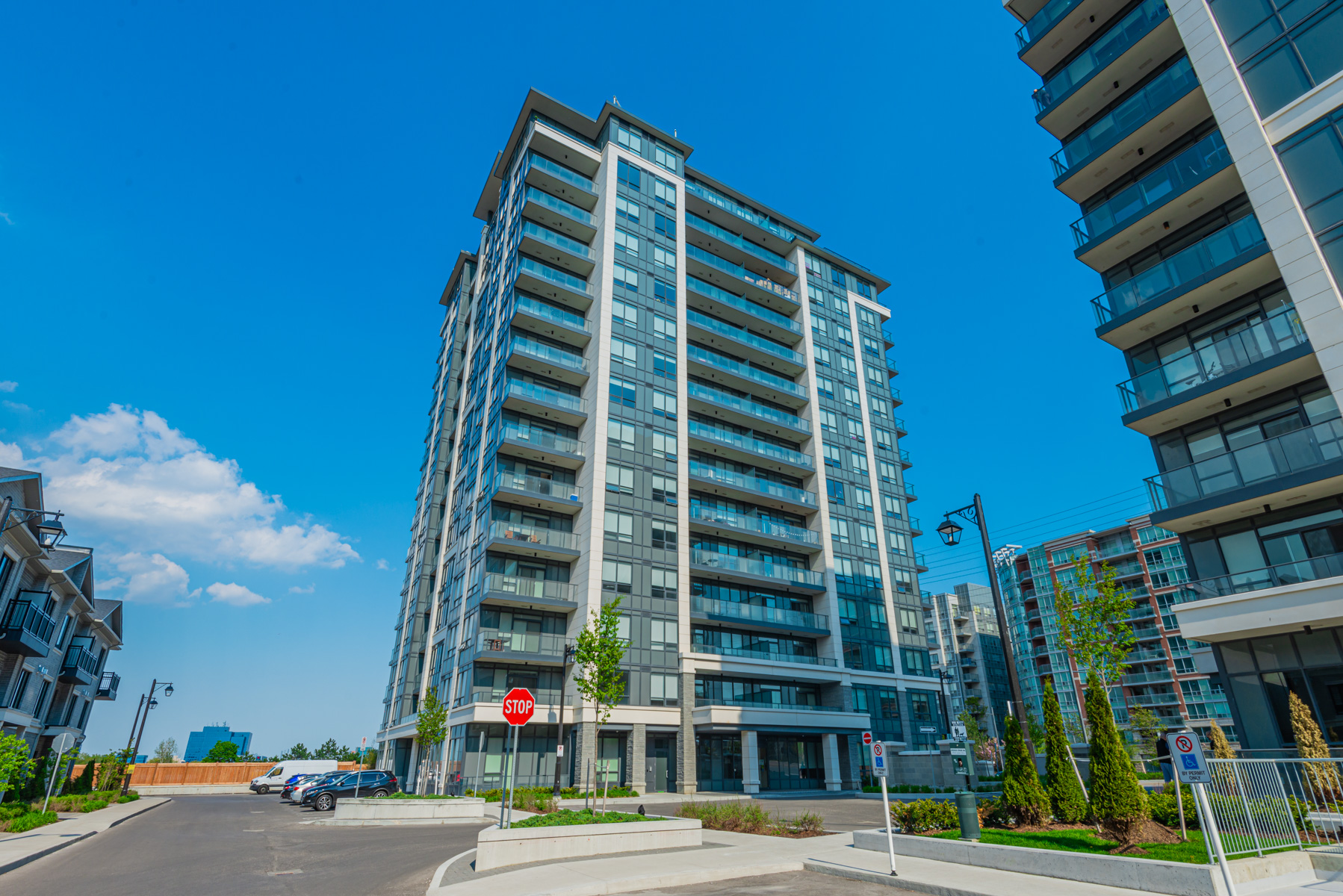 Exterior of Valleymede Towers condo with geometric, rectangular design and blue glass windows.