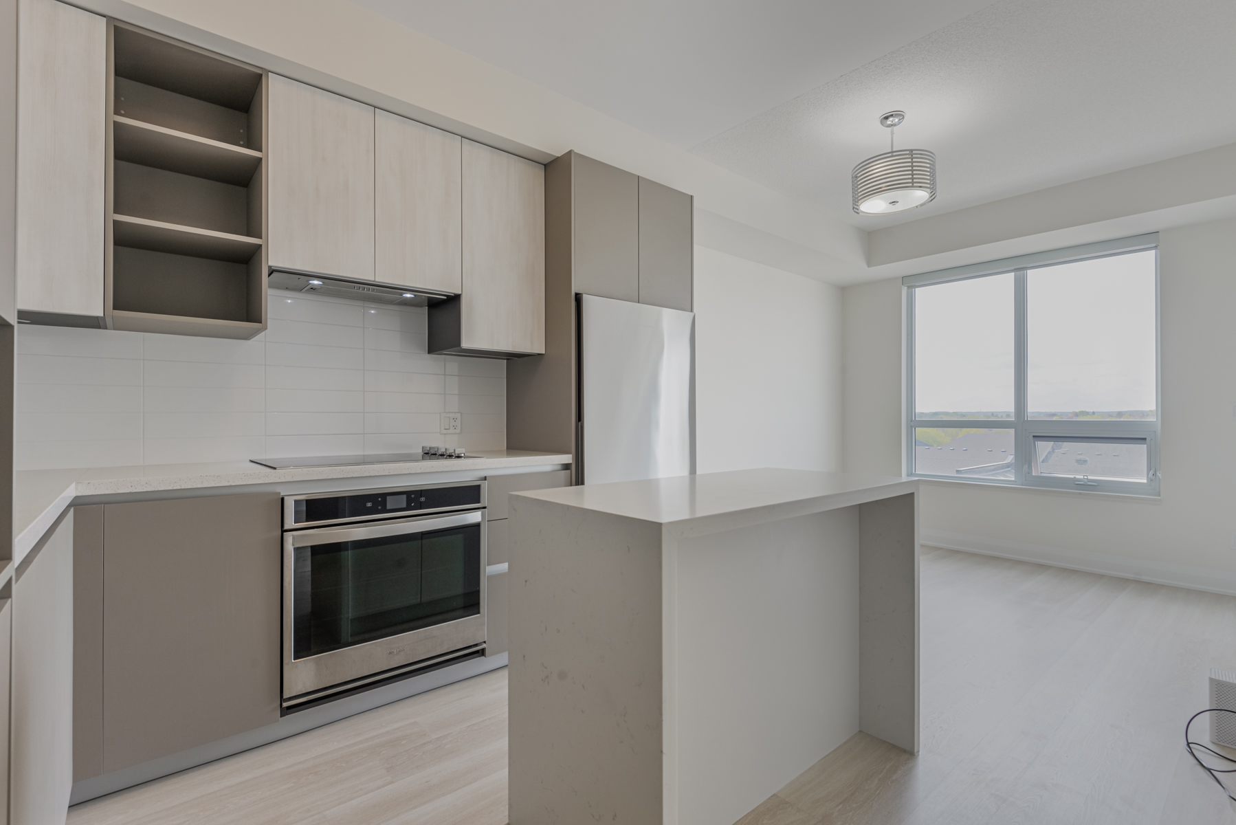 Custom-made quartz island – 398 Highway 7 Rd E Unit 601 kitchen. 