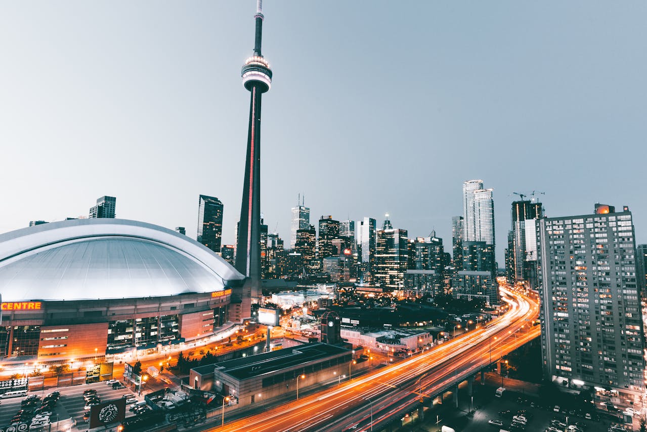 Toronto's CN Tower, Rogers Centre and light trails from highway traffic.