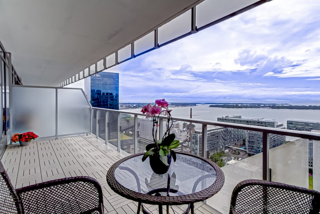 Large condo balcony with bistro set.