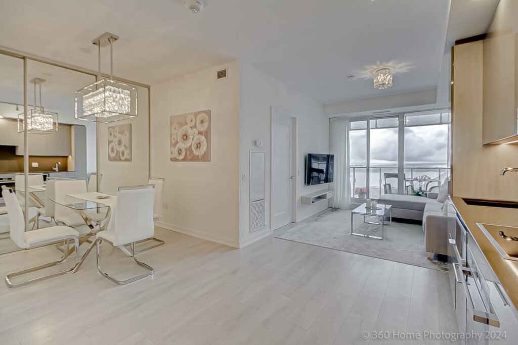 Condo dining area with ornate chandelier.