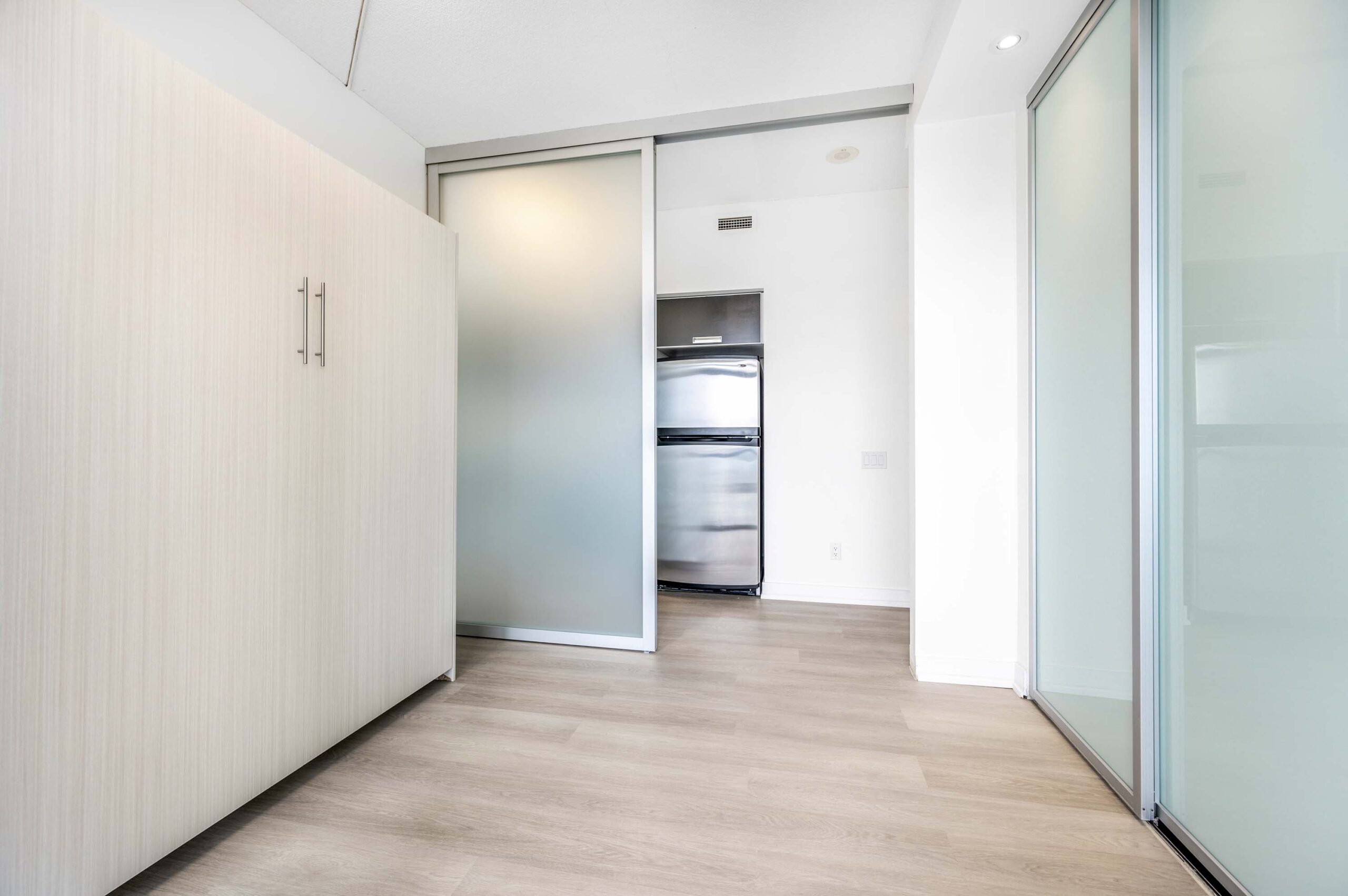 Condo with glazed sliding door and closet.