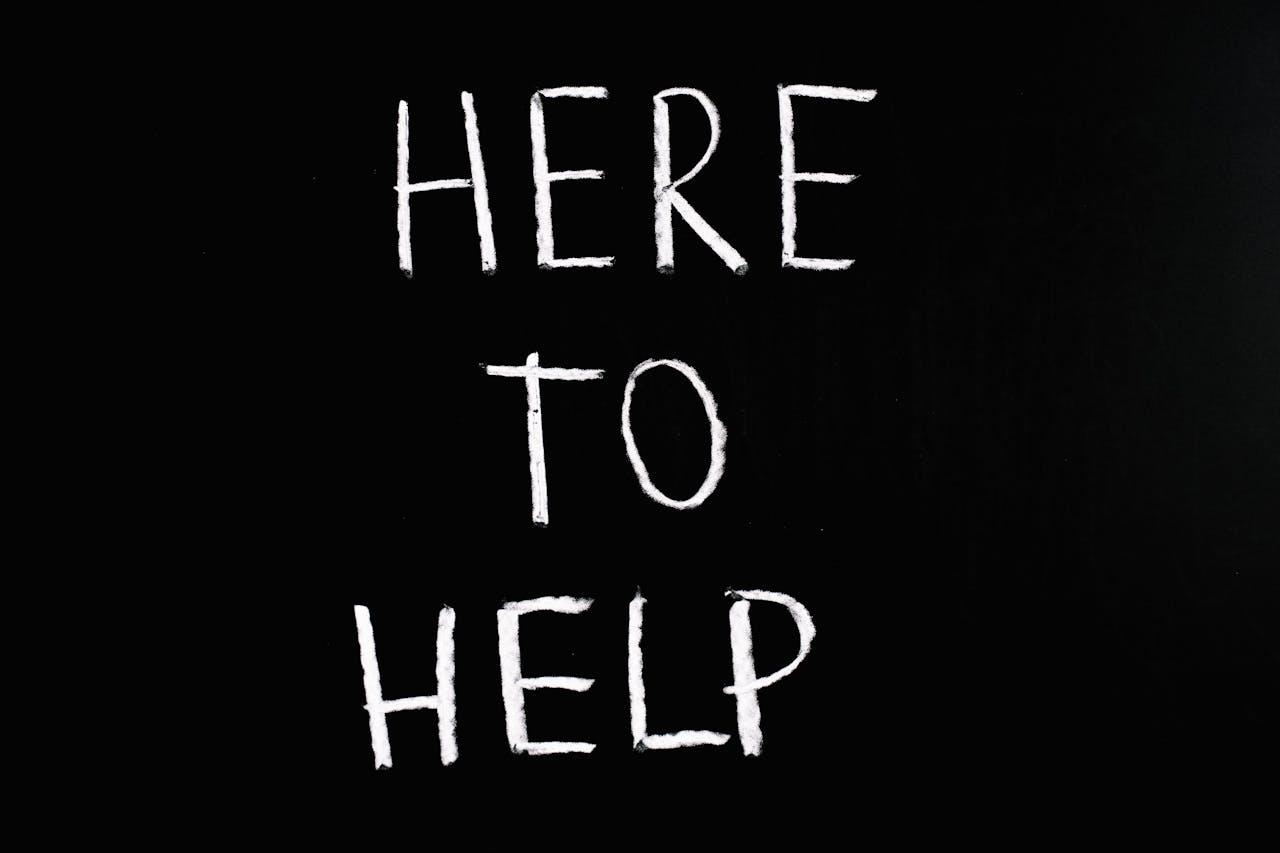 White text "Here To Help" on black background to show advice on how to sell resale property.