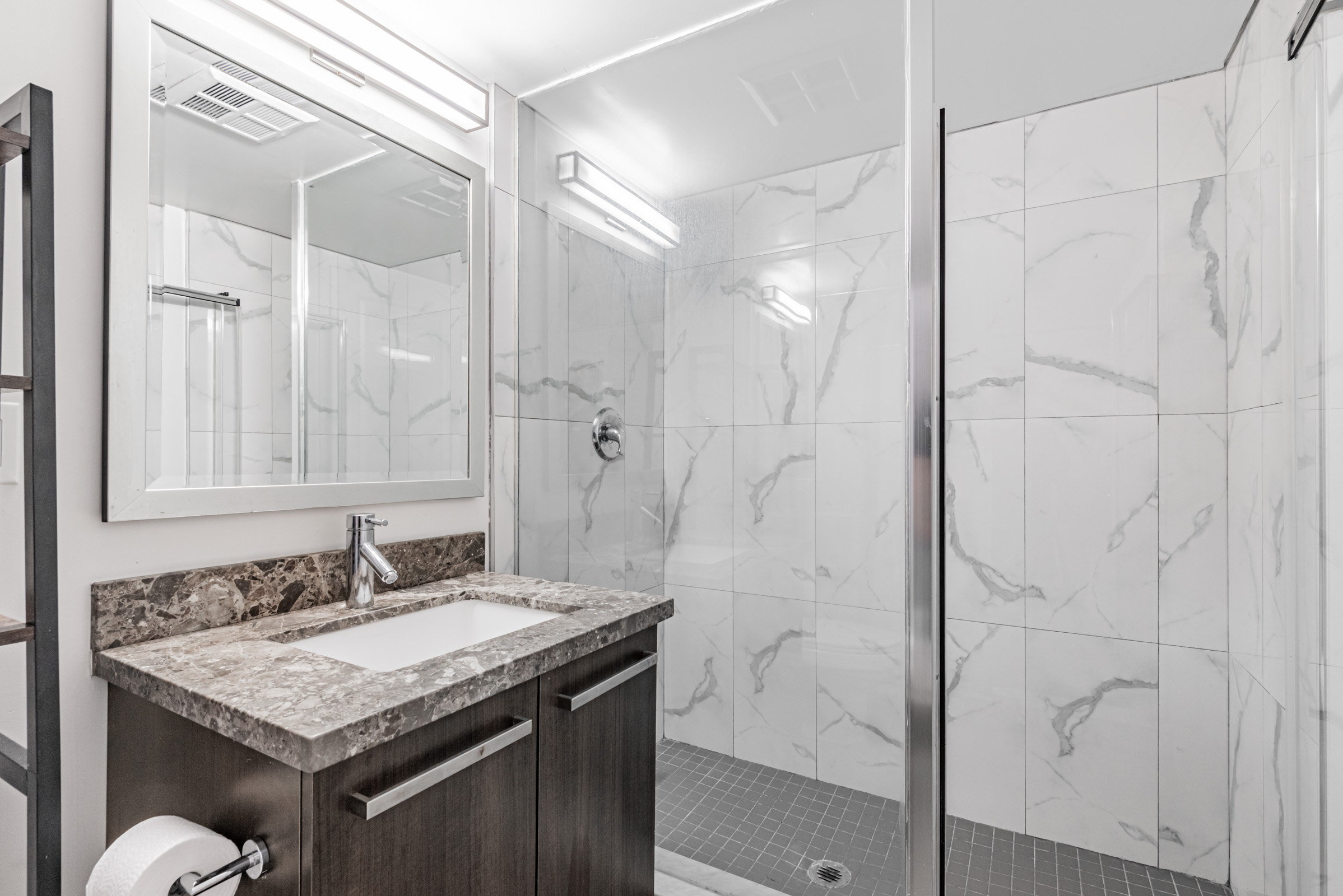 Beautiful 5-piece bathroom with glass shower – 11 St Joseph St Unit 311. 