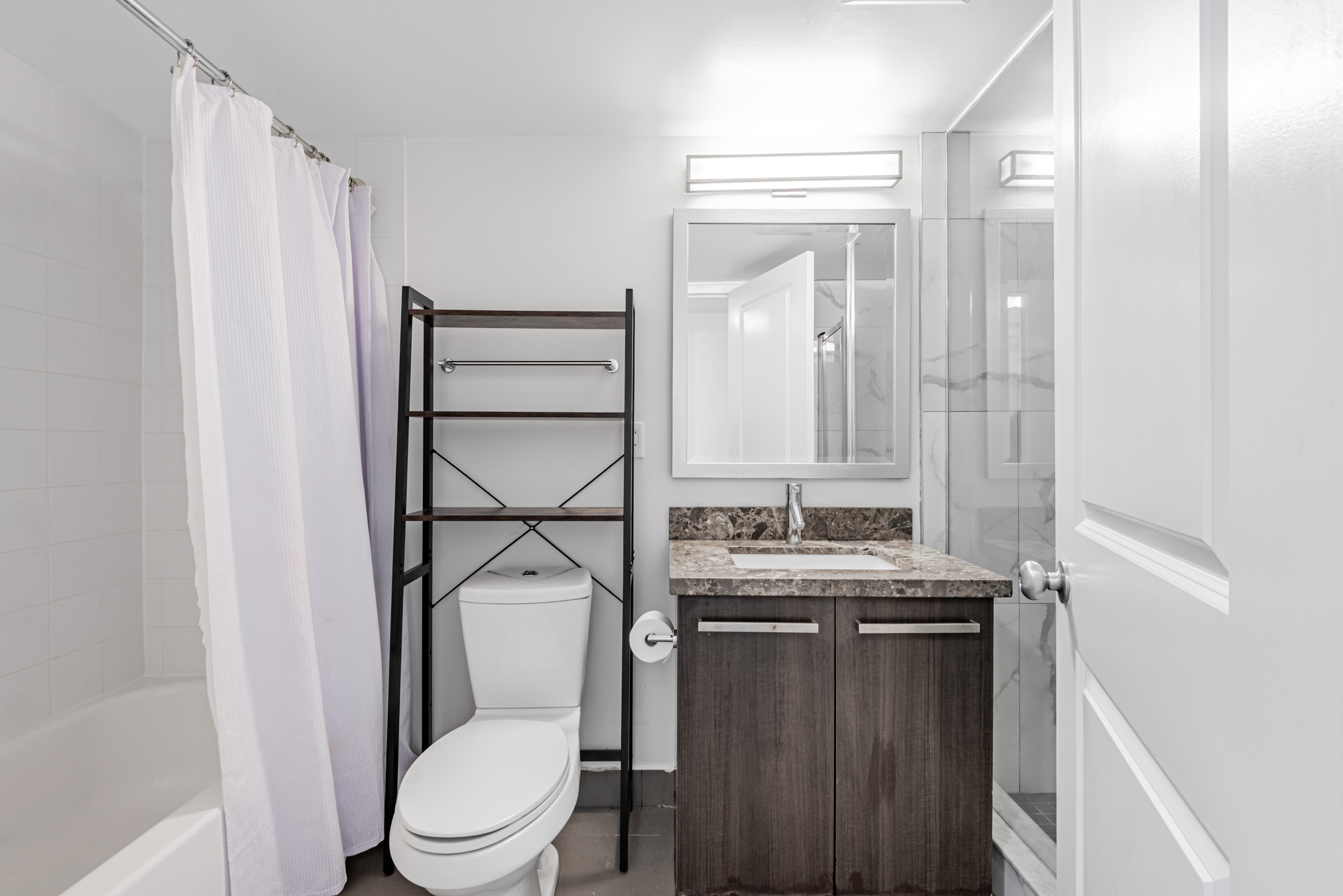 Condo bathroom with soaker tub.