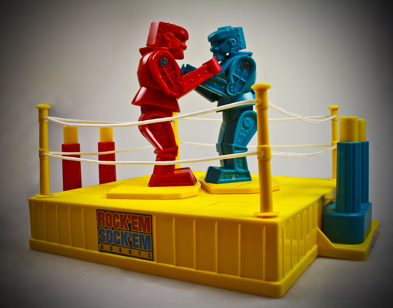 Red and blue Rock 'Em Sock 'Em robots showing contest between GTA home buyers and sellers in August 2025. 
