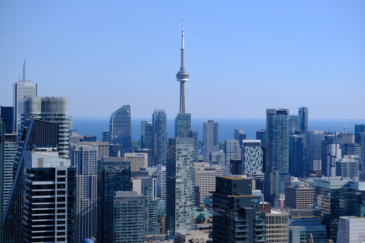 Photo of Toronto skyline featuring CN Tower, condos and Lake Ontario.