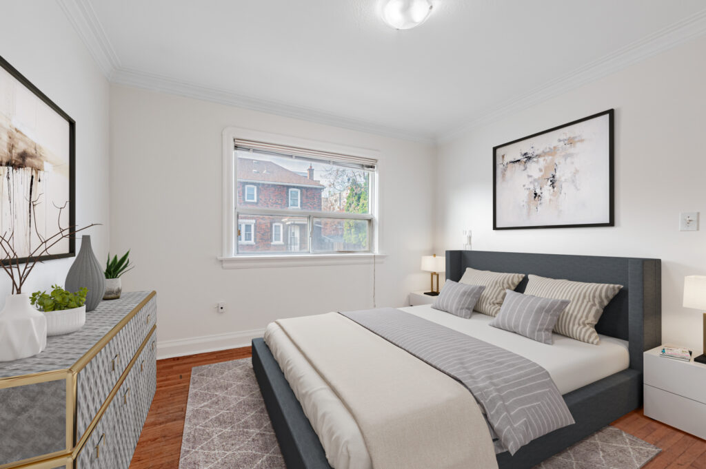 Second spacious bedroom of 42 Carr Street with hardwood floors, LED lights, window, and 3D rendered bed.