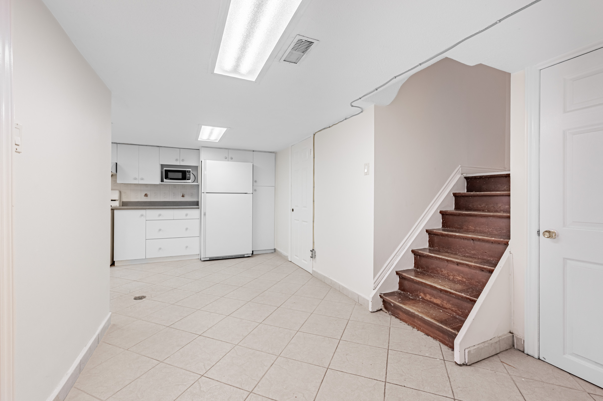 Stairs leading down to 42 Carr St's basement.