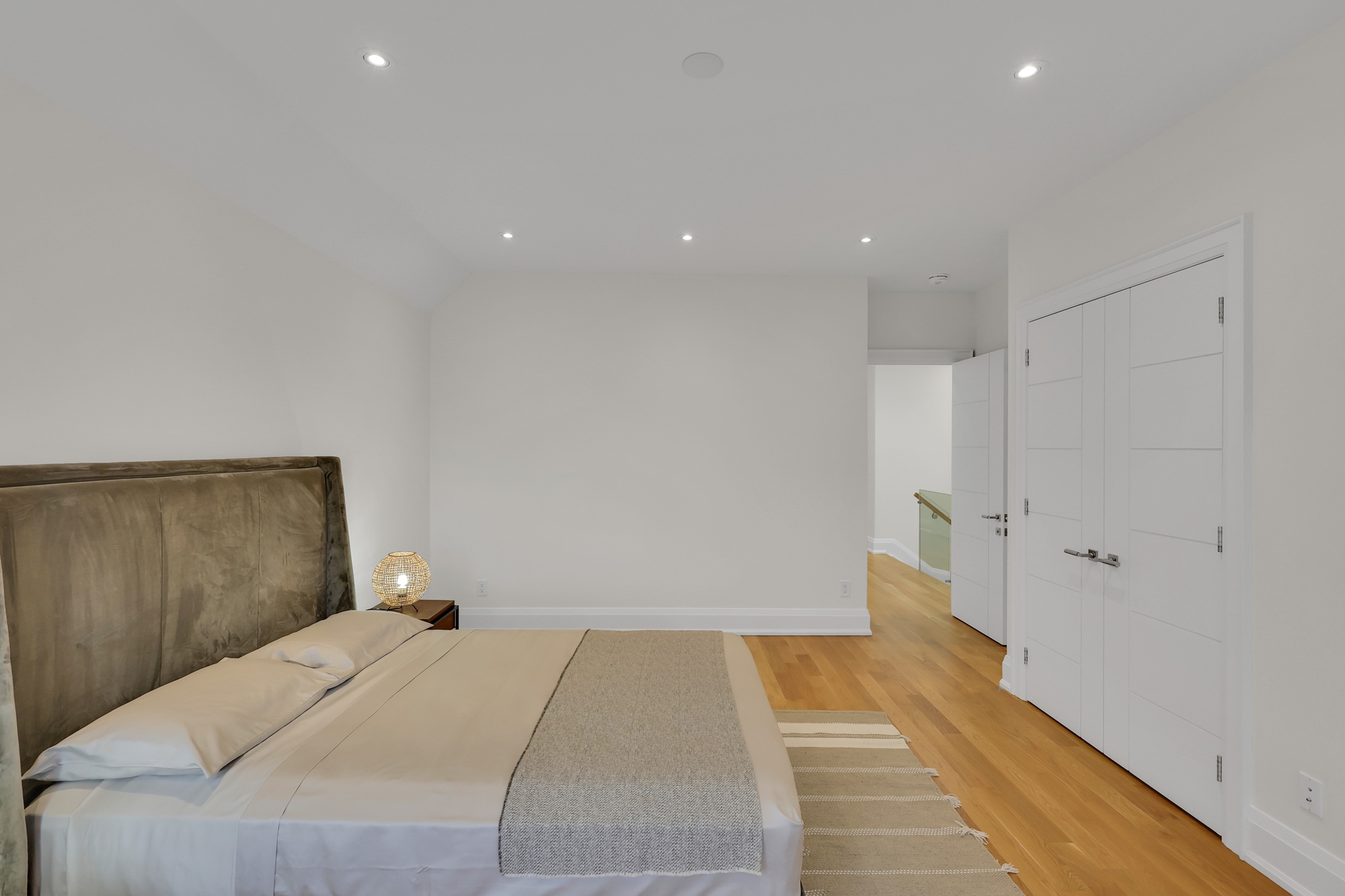 Bedroom with large double-door walk-in closet.