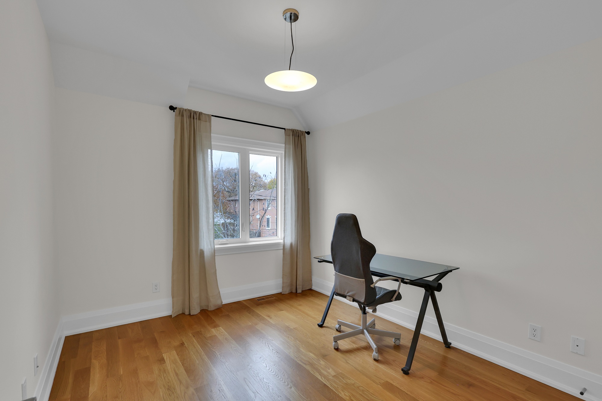743 Glencairn Ave fourth bedroom with desk, chair, hardwood floors and window.