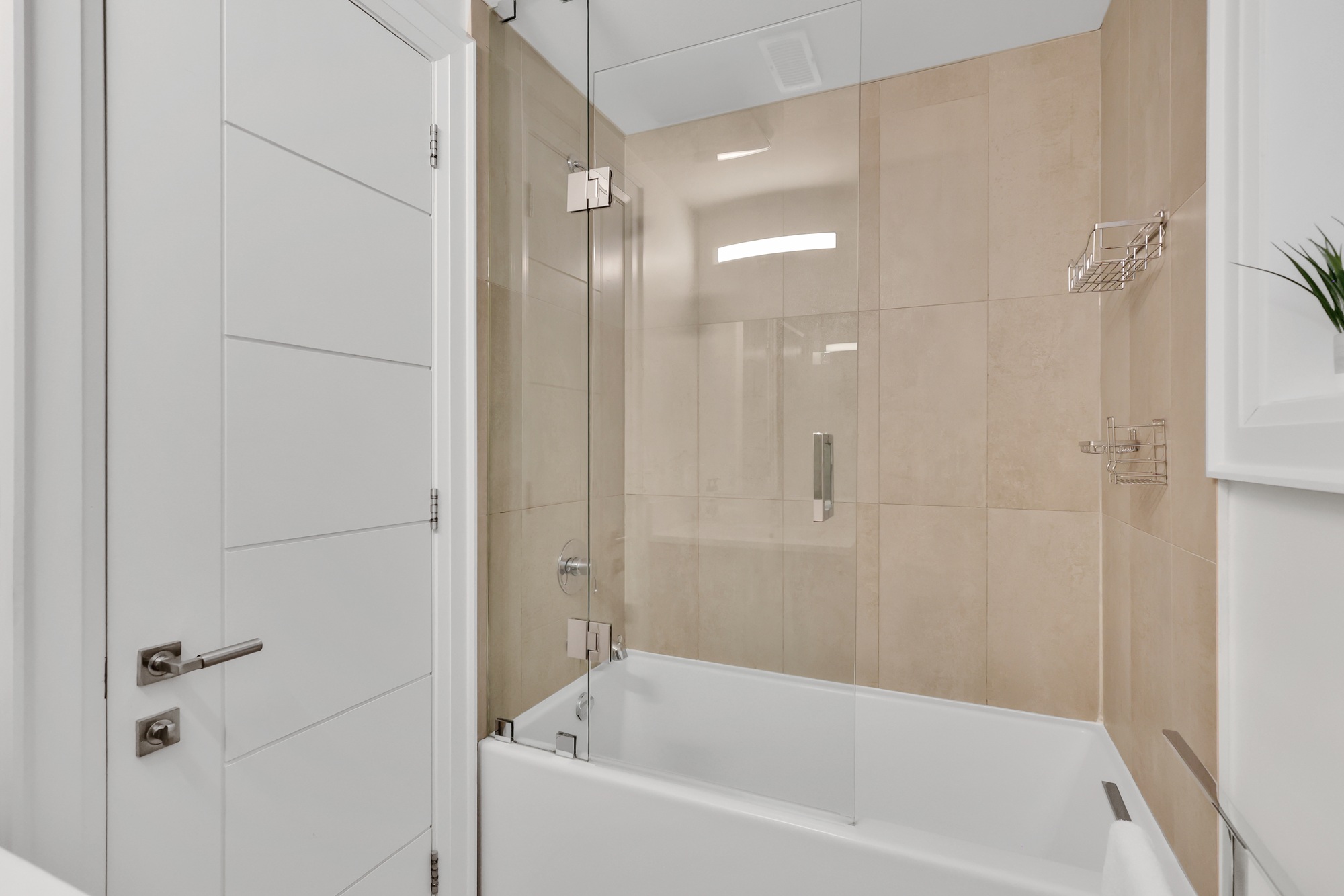 743 Glencairn Ave basement studio unit 4-piece ensuite bath with soaker tub featuring sliding glass door.