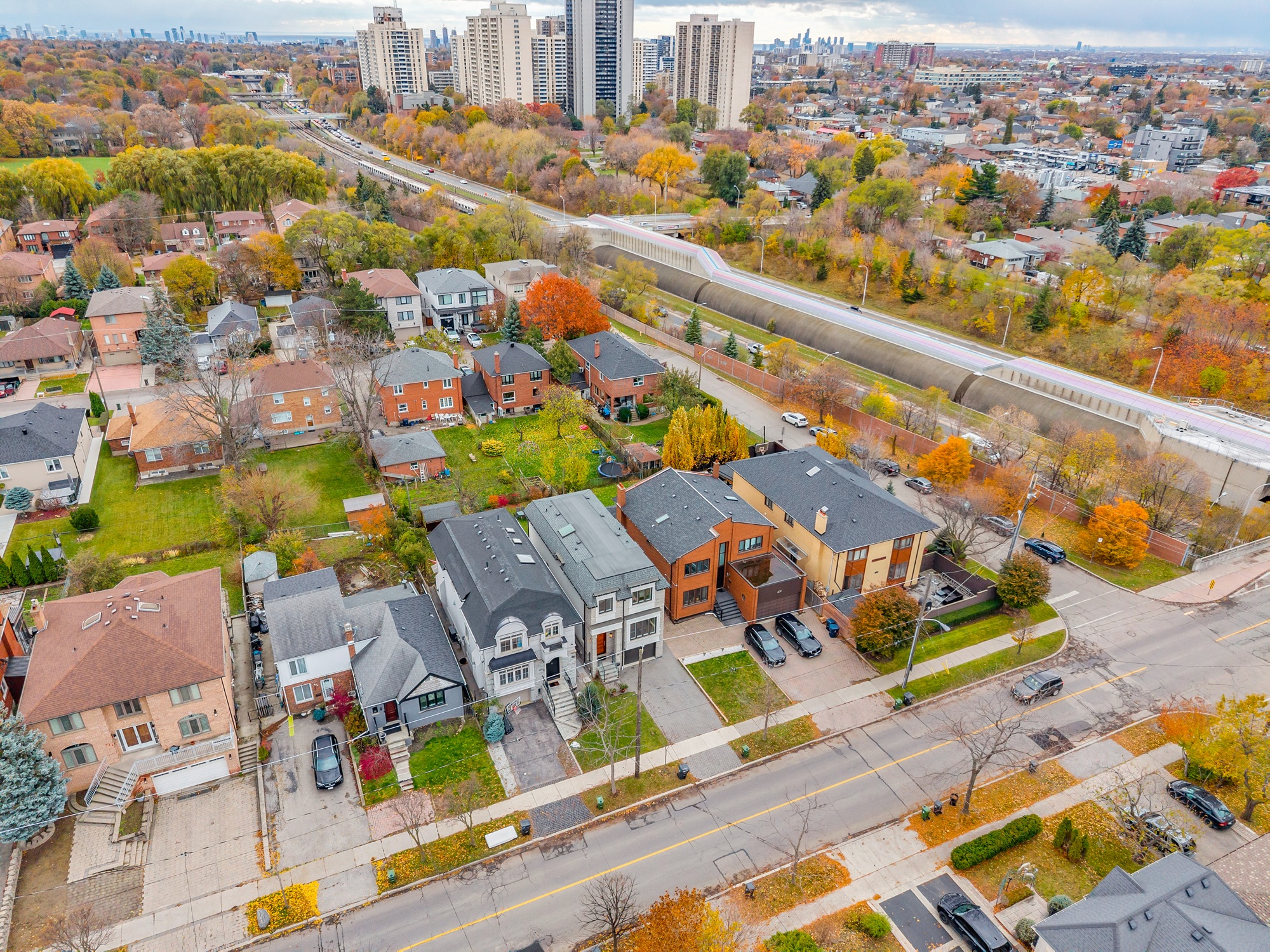 Aerial drone photo of 743 Glencairn Ave in scenic Englemount-Lawrence, North York, with city of Toronto in distance.
