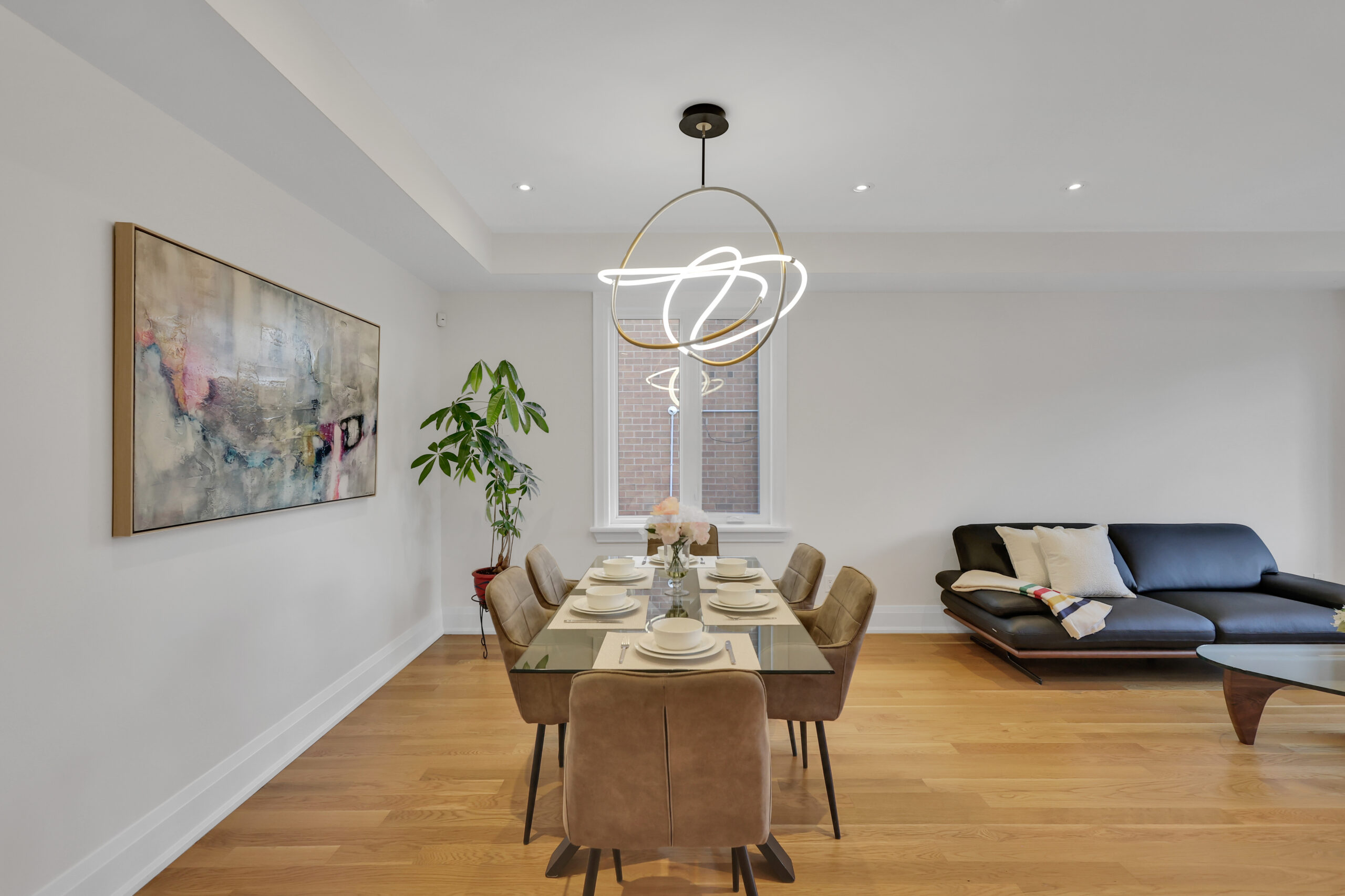 Dining room chandelier with twisted, looped and glowing design. 
