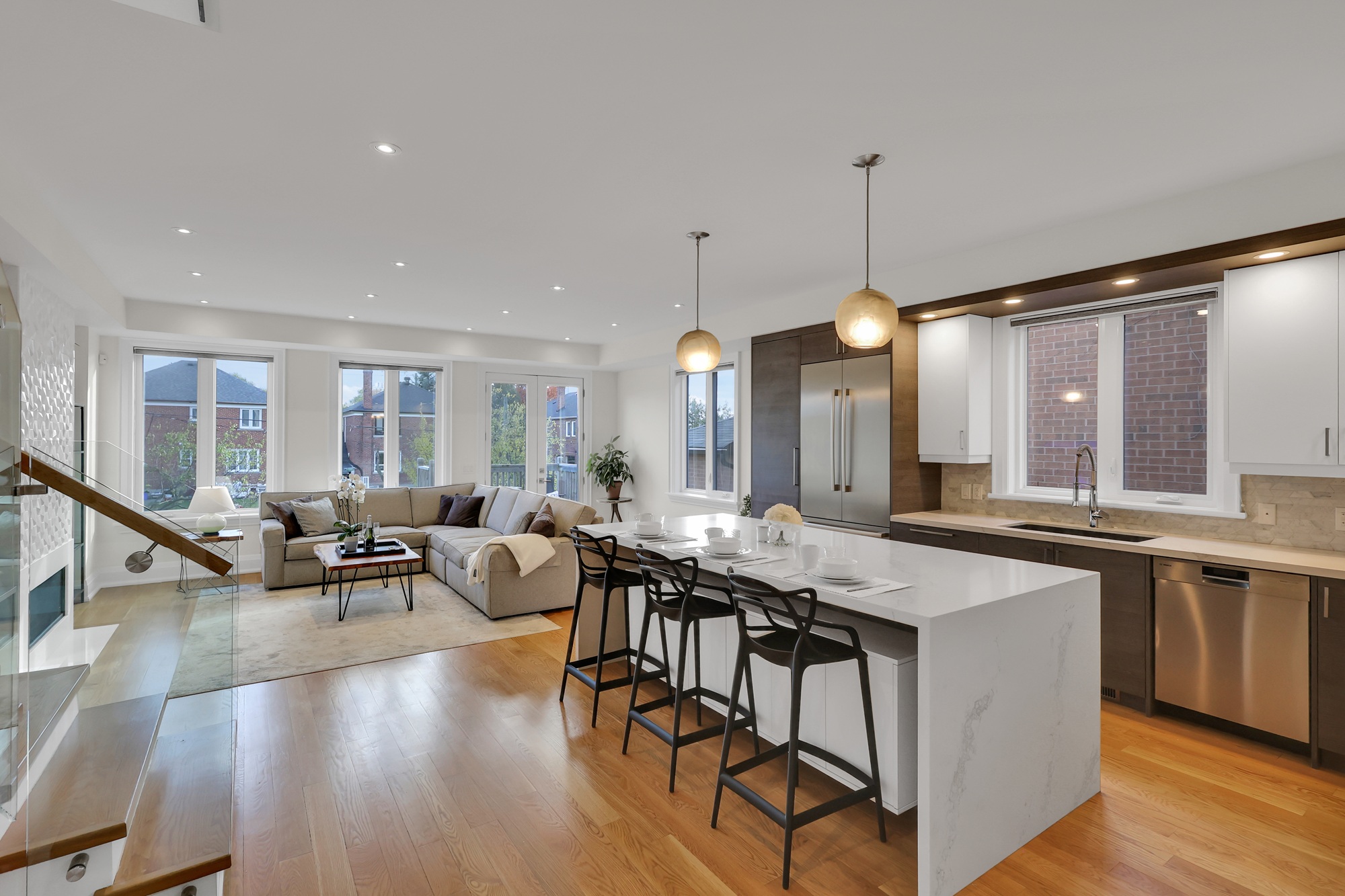 743 Glencairn Ave's gorgeous kitchen with mix of warm and cool colours, dramatic lighting, and upscale materials. 