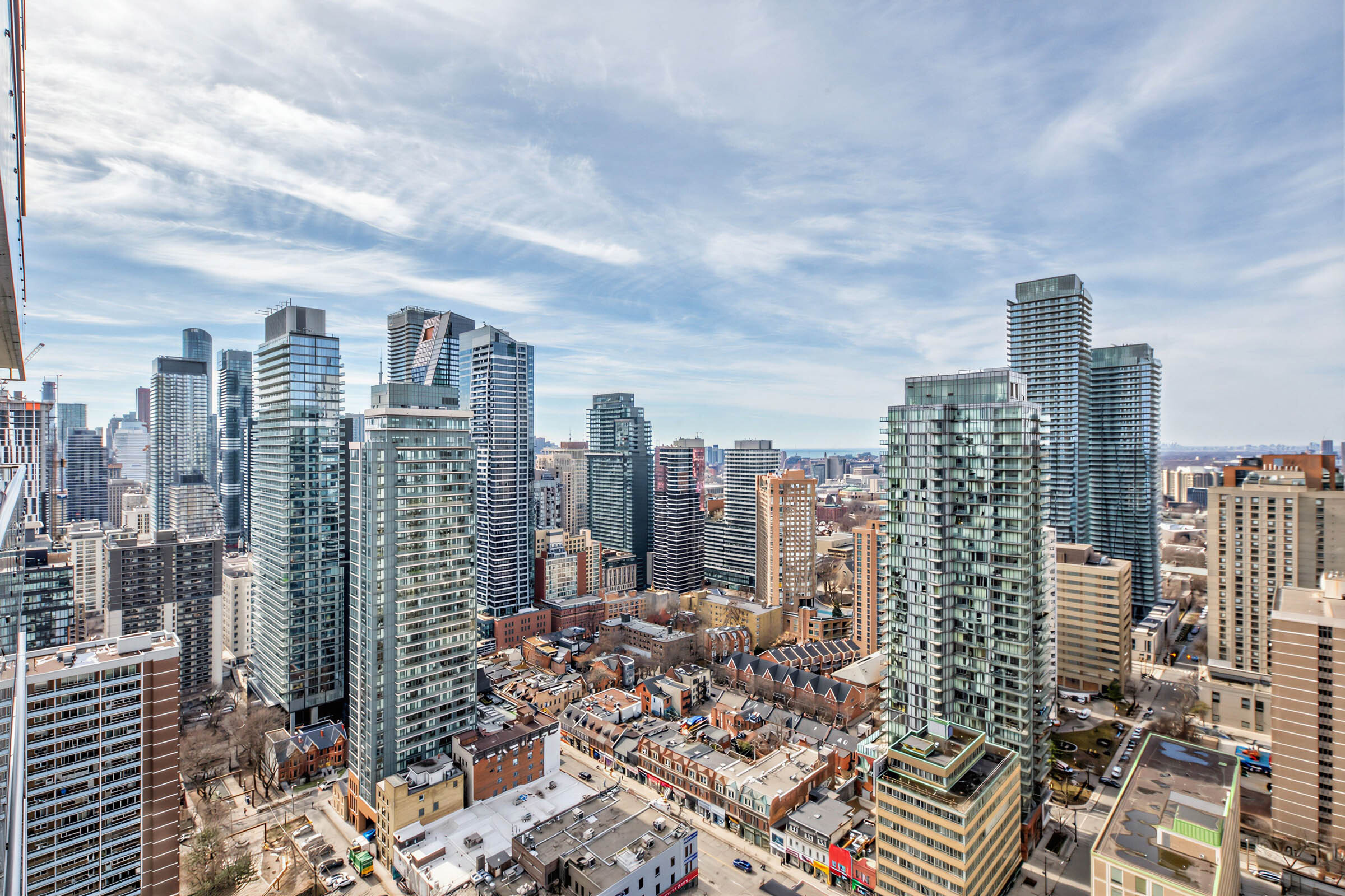 View of high, low and mid-rise buildings in Toronto's Church-Yonge Corridor seen from 33 Charles St E Unit 3206's balcony.