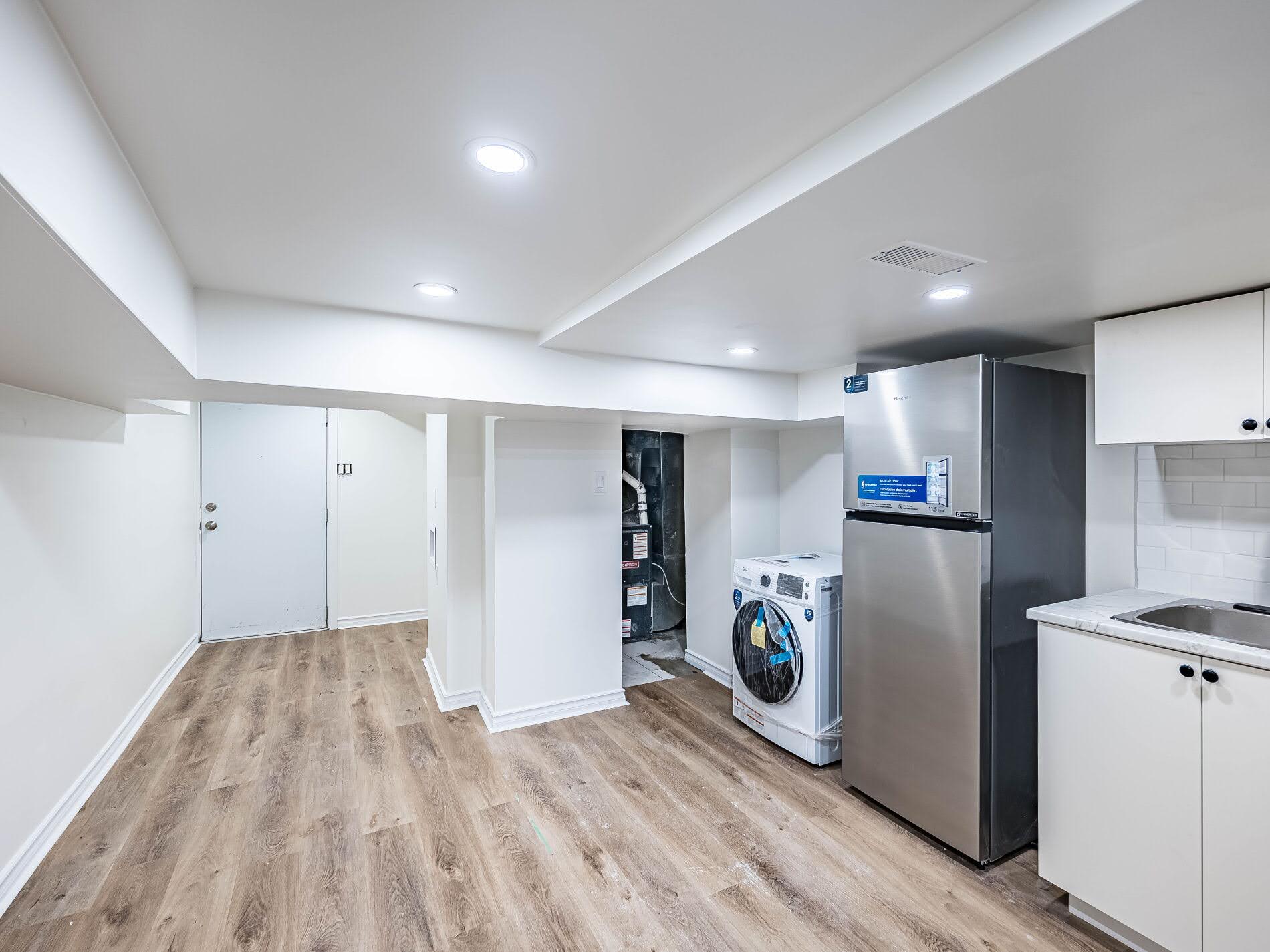 Large basement kitchen with room for dining table and chairs.