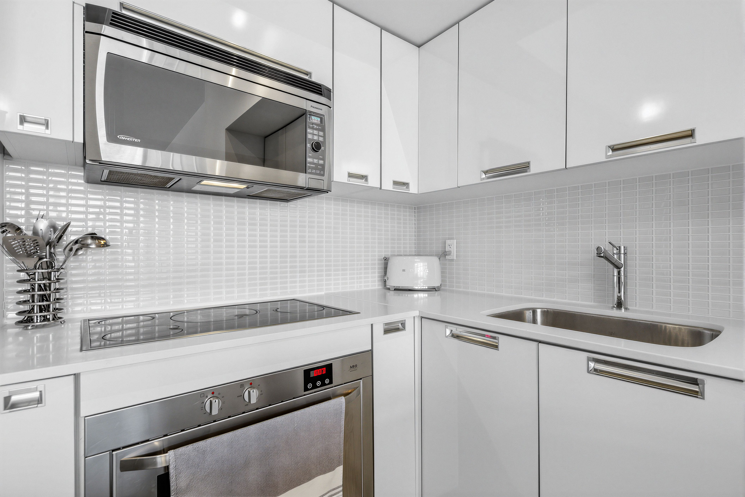 Close up of mosaic backsplash with ceramic tiles.