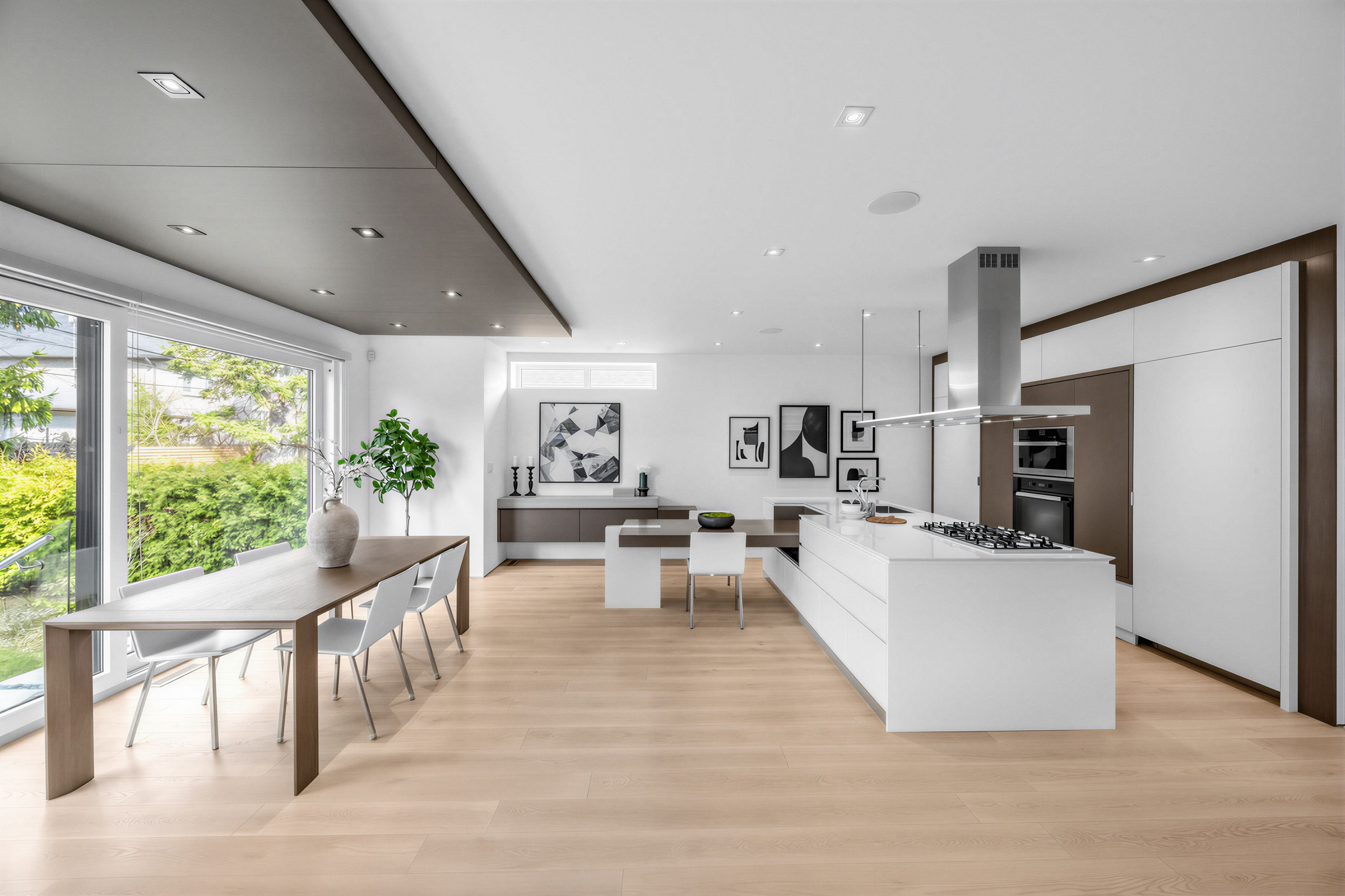 Dining room and kitchen with dark brown accents.