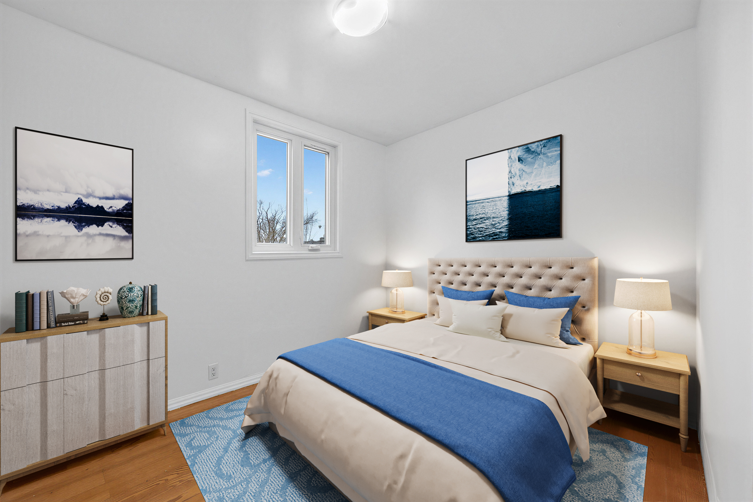 57 Shanly St 2nd floor smaller bedroom with large bed, window and dark floors.