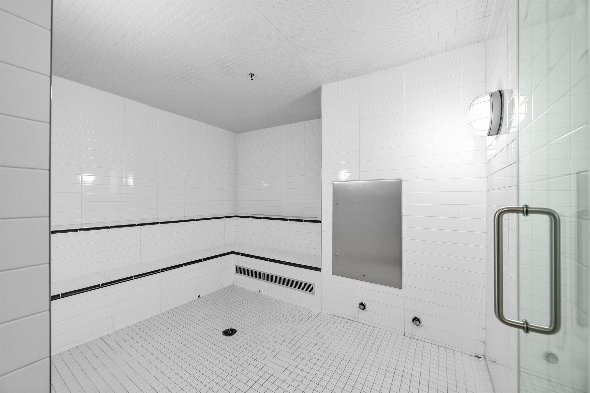 Backstage Condos white-tiled sauna. 