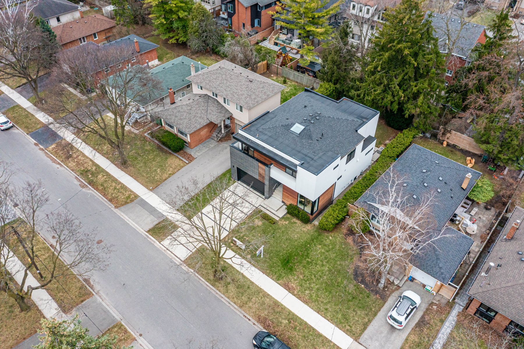 Aerial drone view of 52 Burrows showing house at an angle along with neighbouring houses.