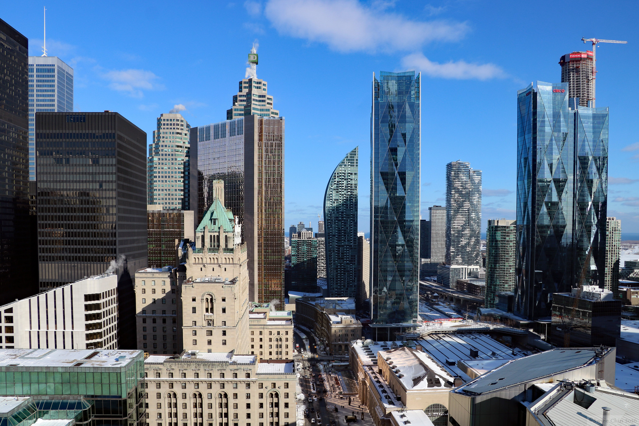 Modern Toronto Financial District skyline showing shiny condos and office buildings, including TD Tower and CIBC building.