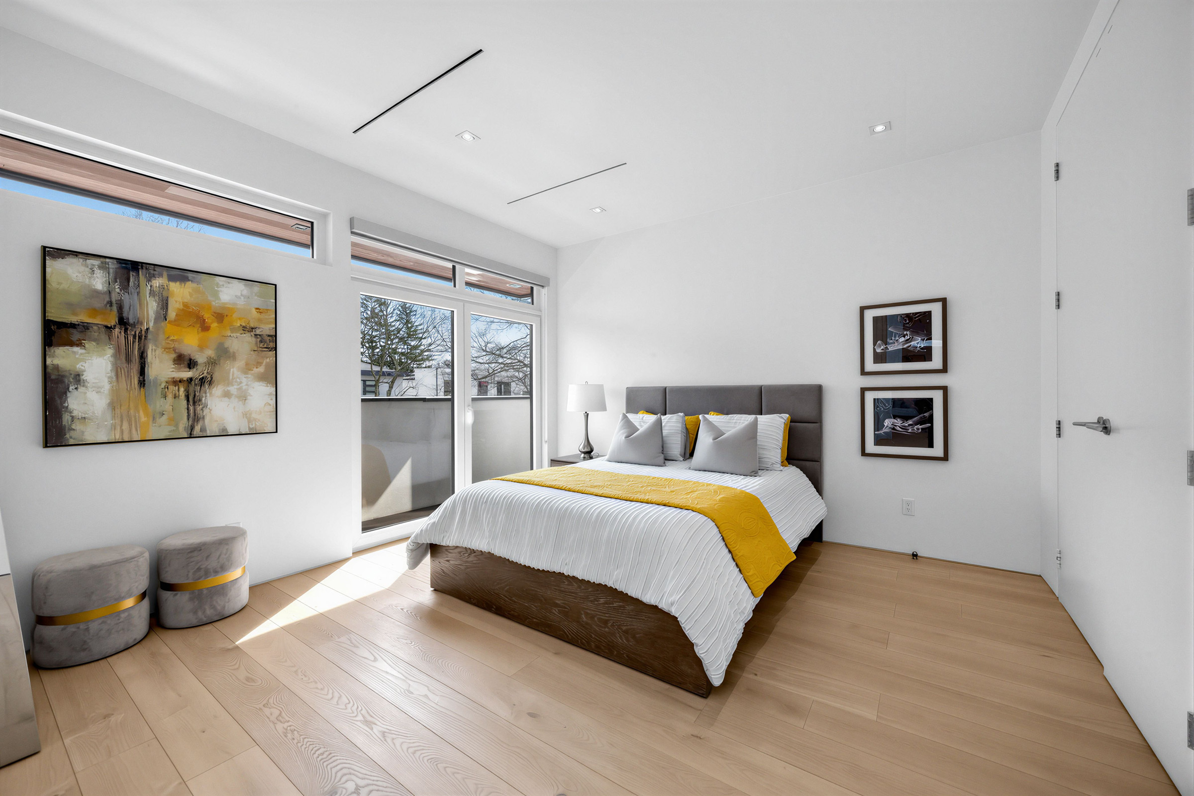 52 Burrows Ave 3rd bedroom with hardwood floors, recessed lights, transom windows, and a walk-out balcony.