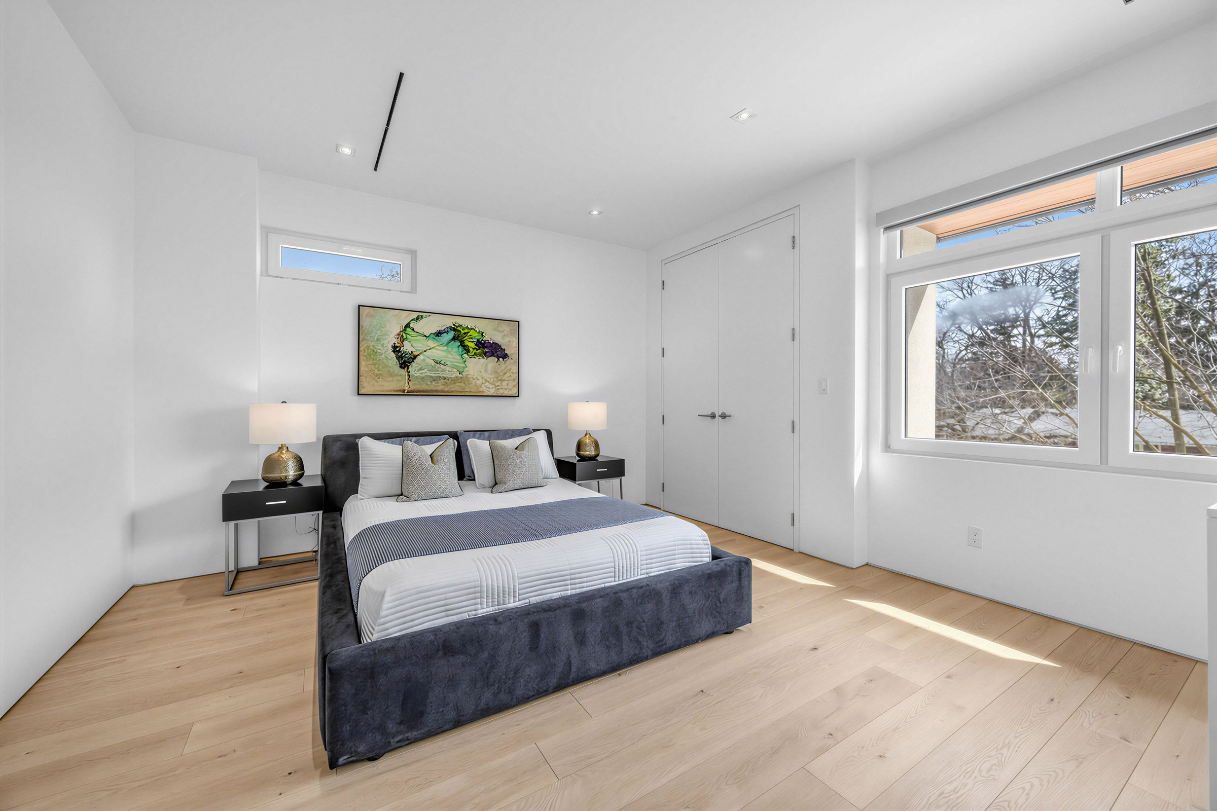 52 Burrows Ave 4th bedroom with bed, hardwood floors, potlights, double-door closet, and two large windows.