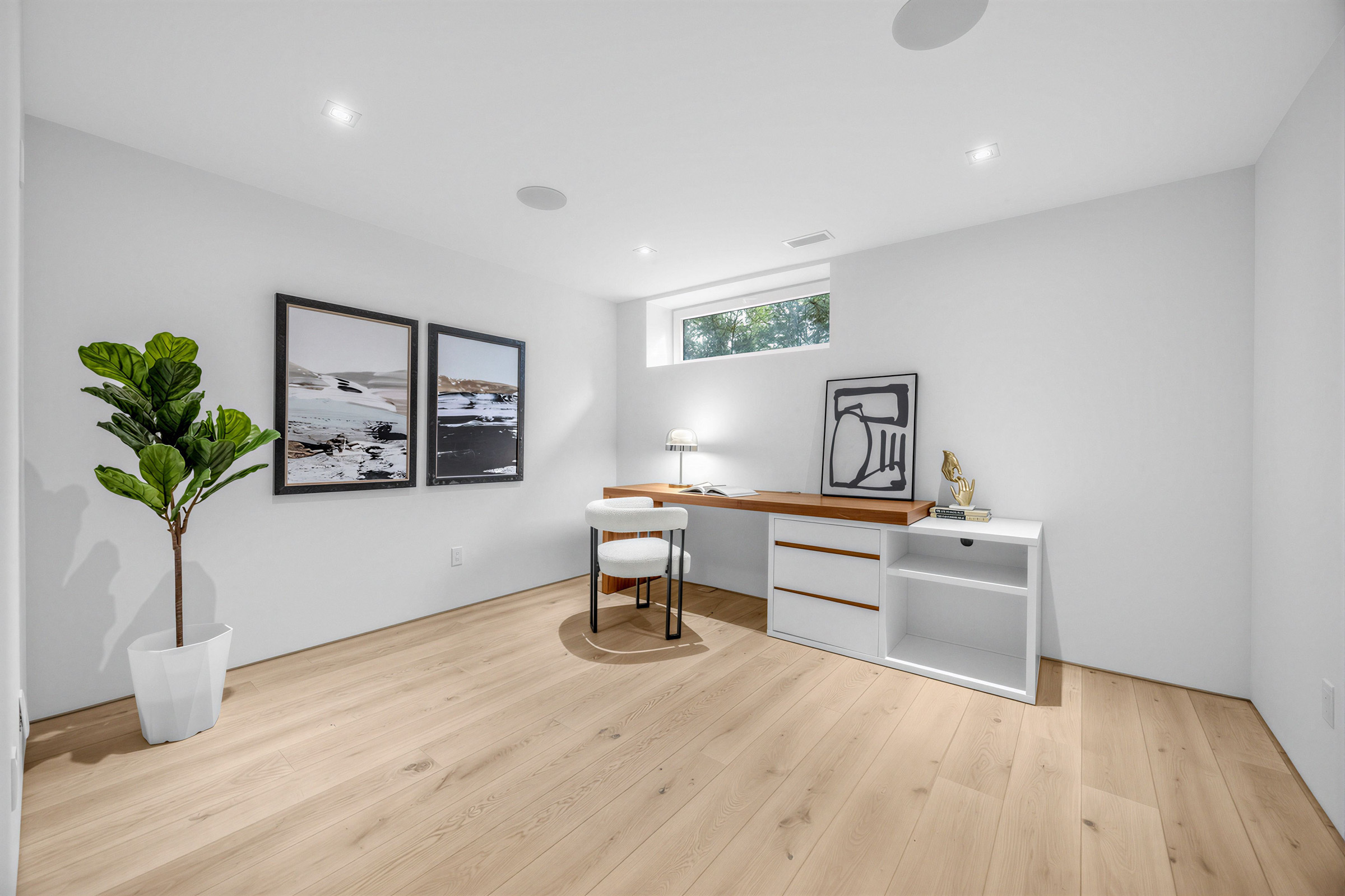 Basement exercise room being used as home office.