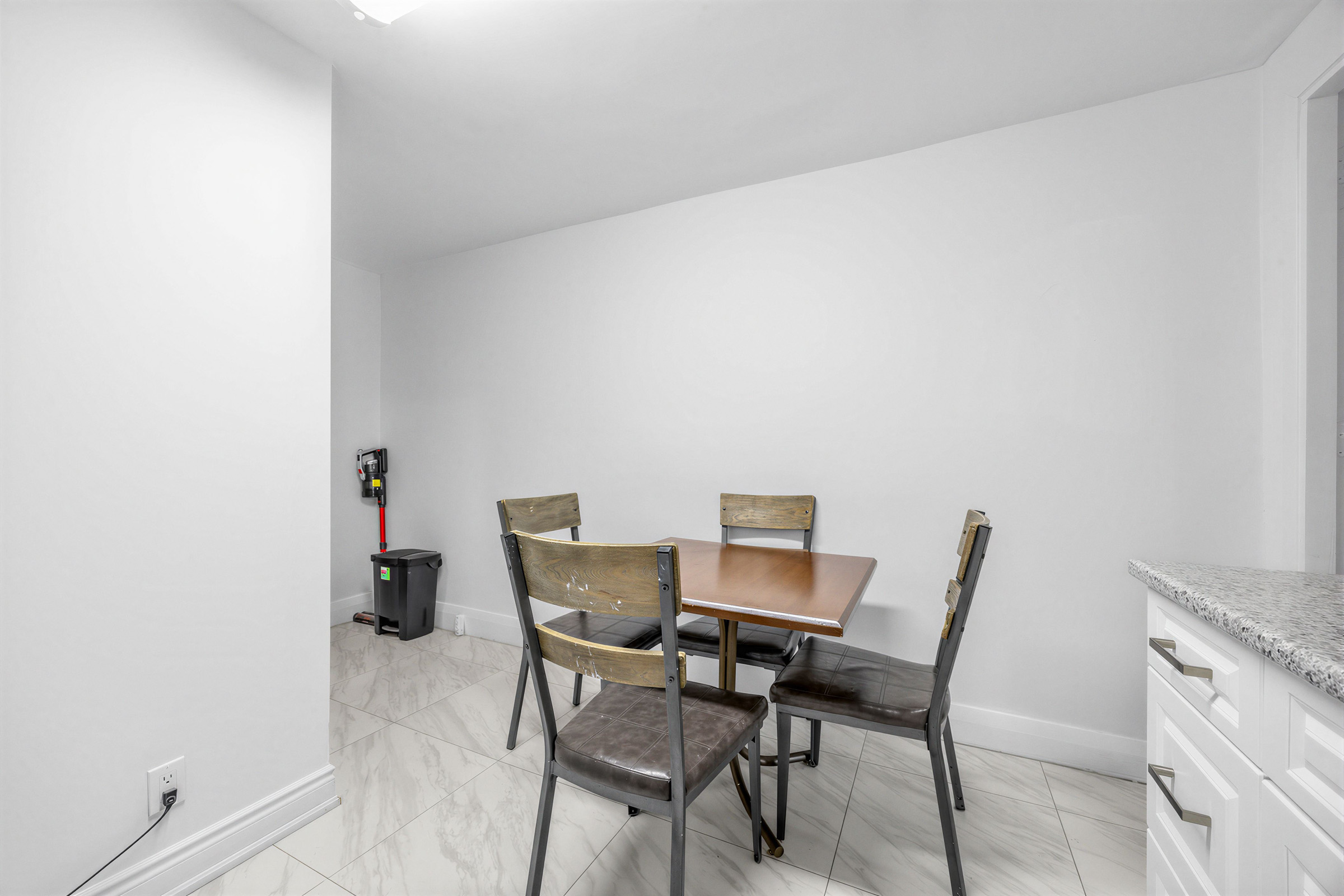 57 Shanly St dining room with square table and four chairs.