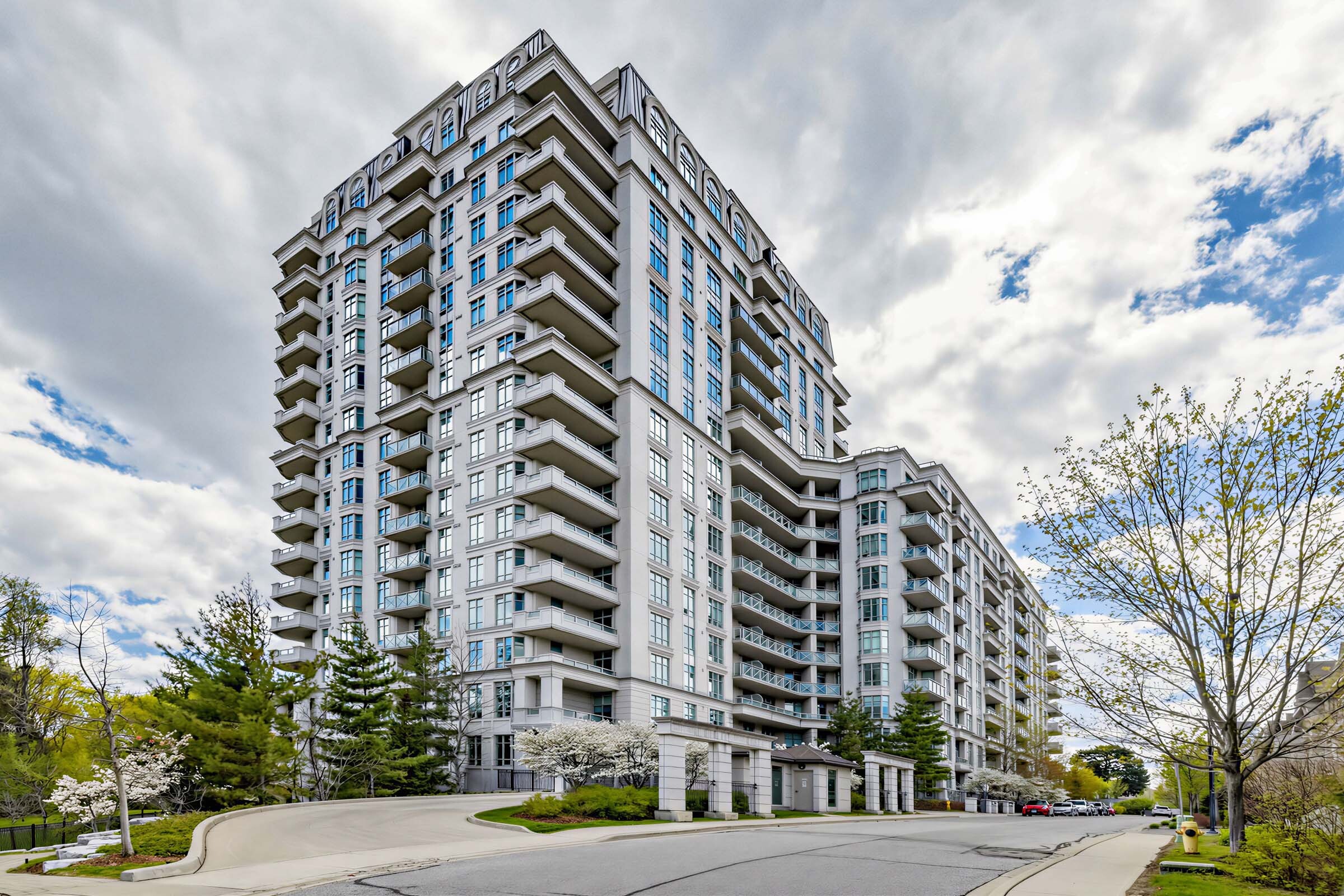 Across-the-street view of Aria Condos and its symmetrical, geometric facade.