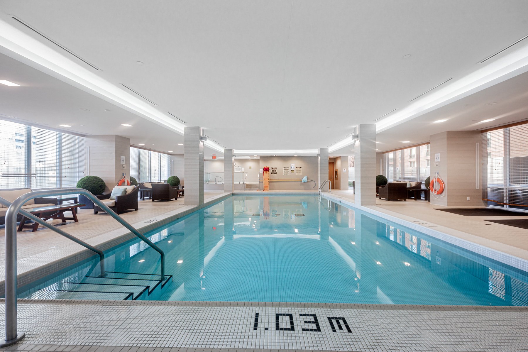 One Bedford condo's large indoor saltwater swimming pool amenity.