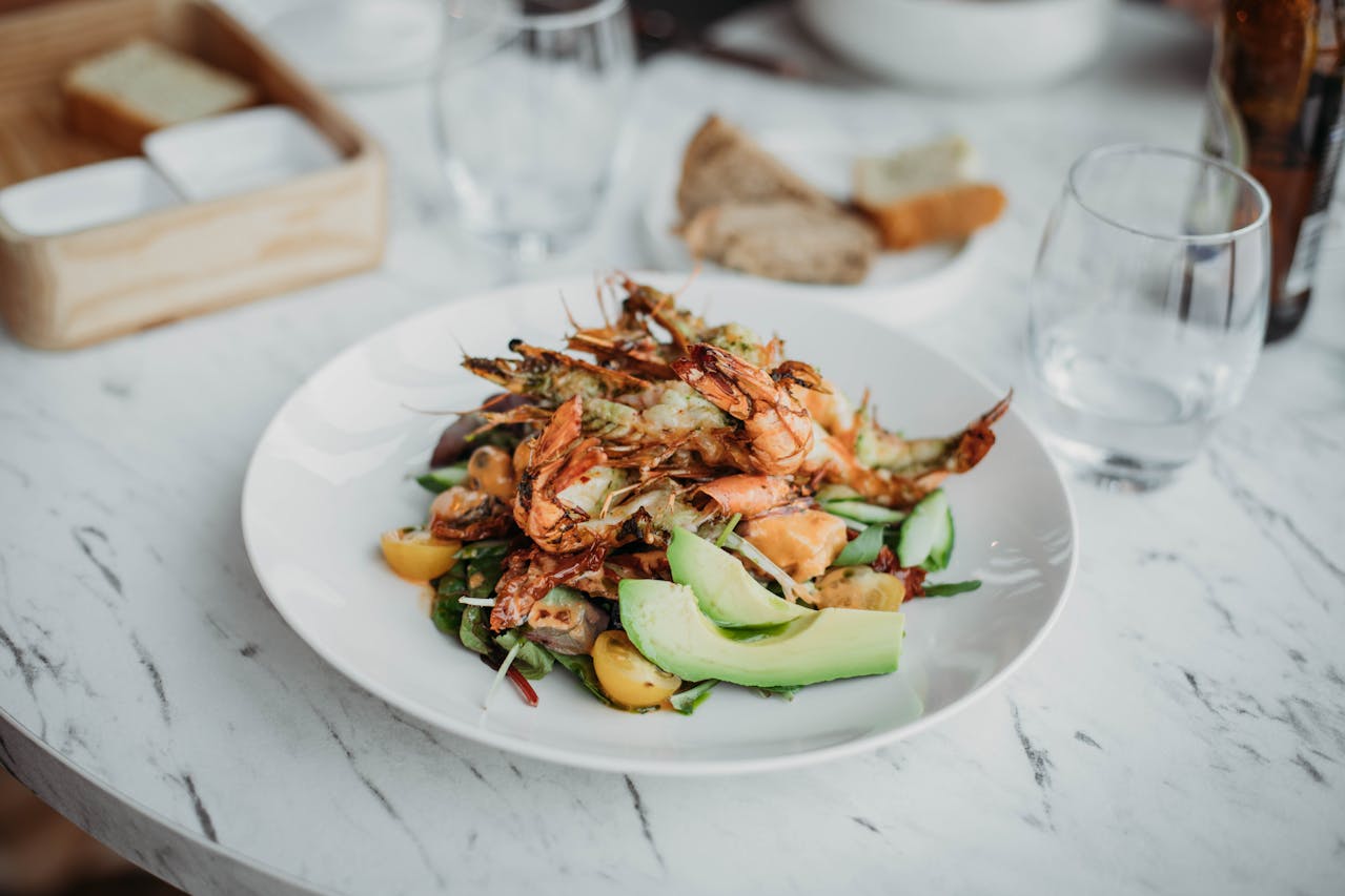 Plate of seafood with shrimp and salad.