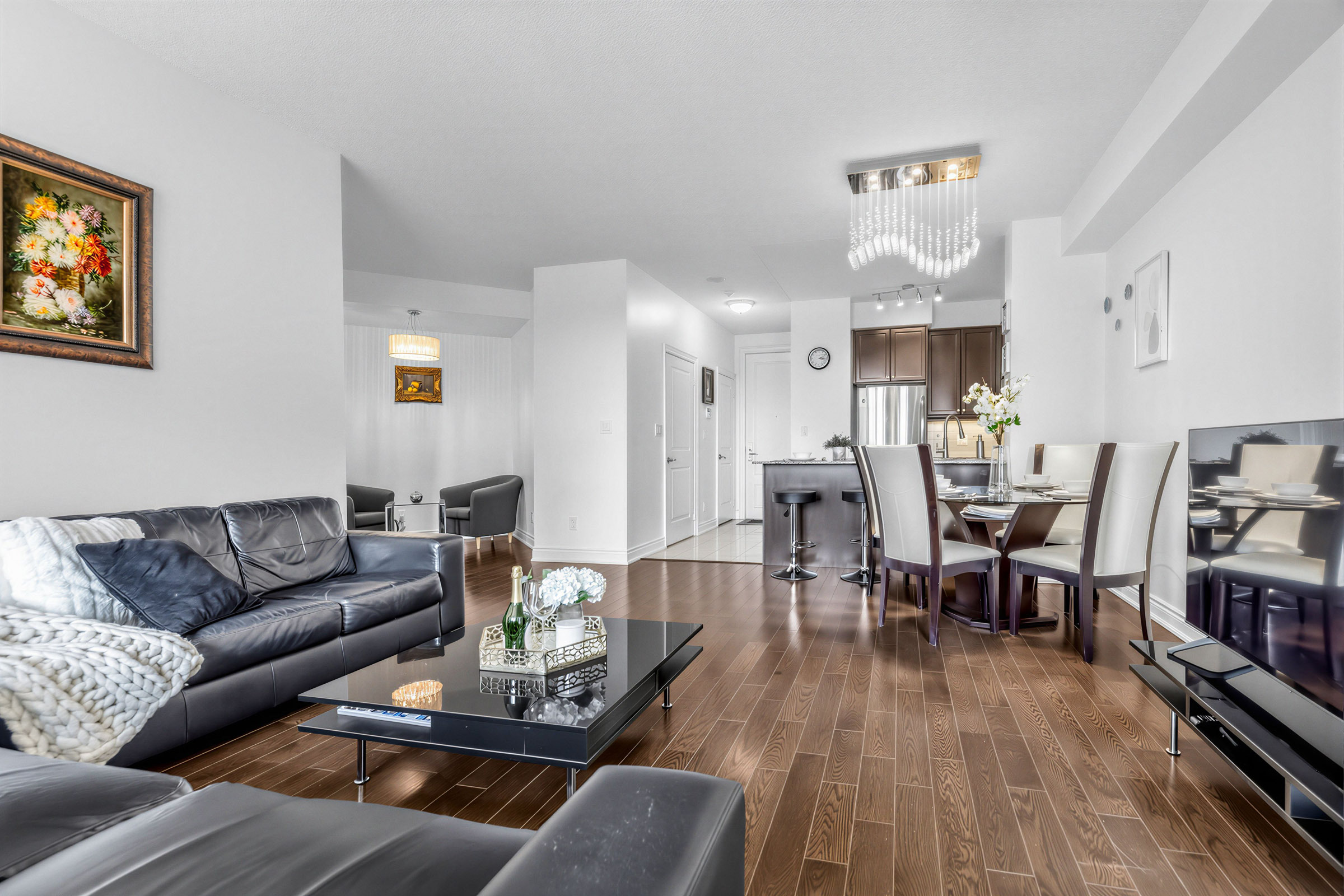 20 Bloorview Place Unit 1003 dining room's cascading crystal chandelier.