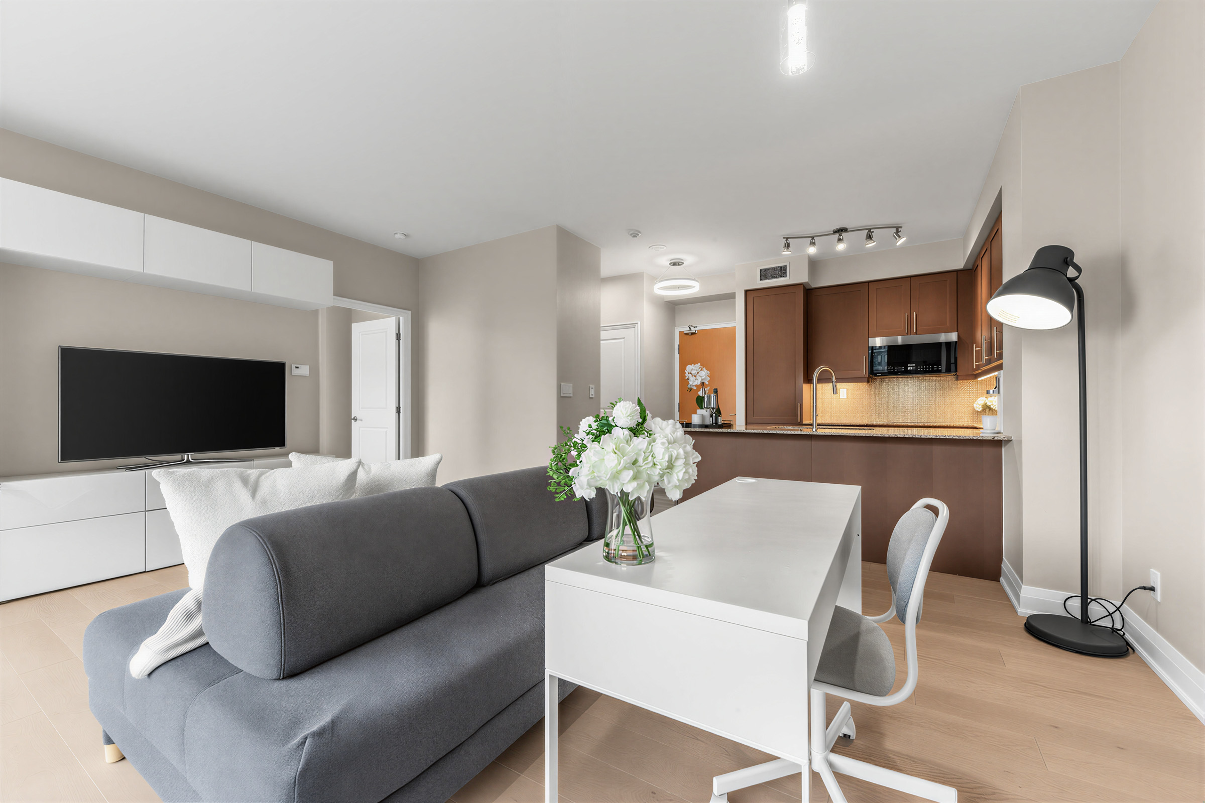 1 Bedford Rd Unit 603 dining room with table and LED pendant lamp.