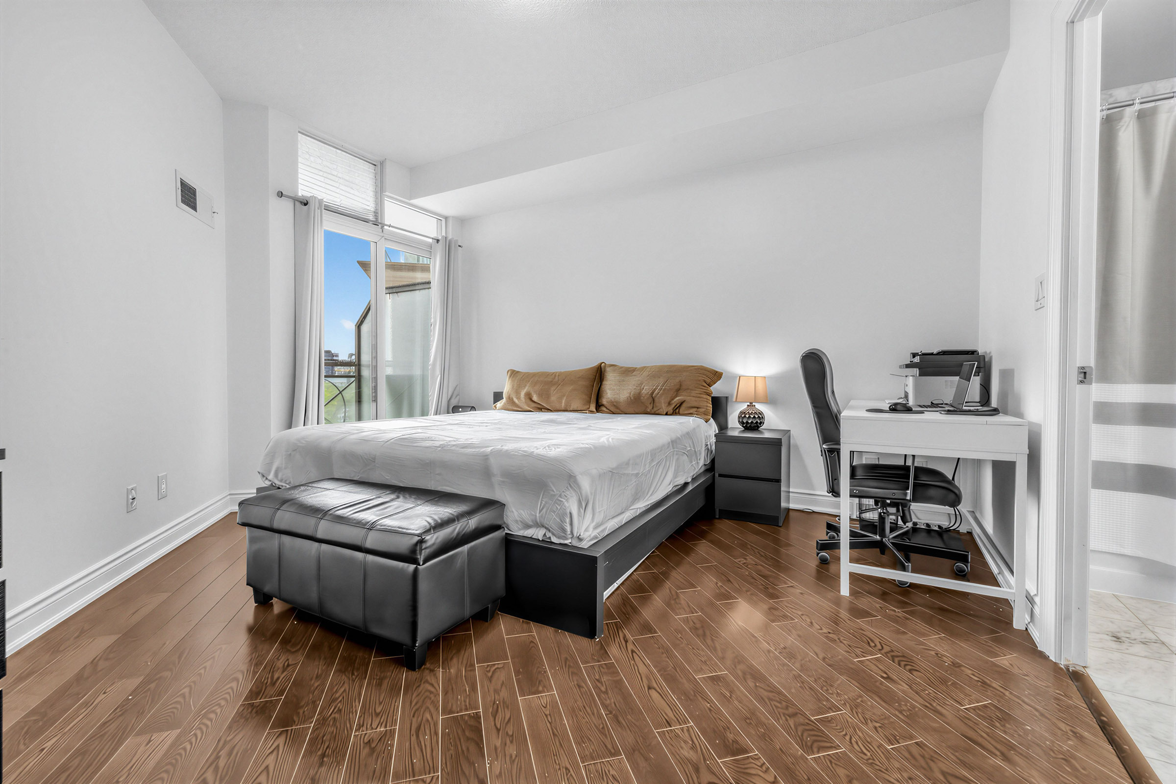 20 Bloorview Place Unit 1003 primary bedroom with hardwood floors at an angle.